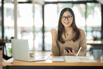 Asia businesswoman working on digital tablet executives meeting in an office using laptop...