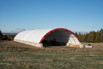 Construction of a commercial fabric building. Fabric warehouse. Prefabricated. Canvas building. Canvas dome.  Dome. Hoop building. Storage. Fabric structure.  Commercial dome. Storage. Agricultural. 
