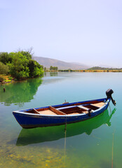 Butrint Lake with a boat in Butrint National Park, Buthrotum, Albania