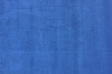 Blue plastered wall, design, construction, texture. Background for design.