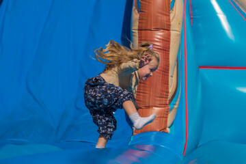 Kids, girl having fun and sliding on outdoor playground. Kids Enjoying