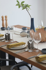 The dining table is decorated for eating.