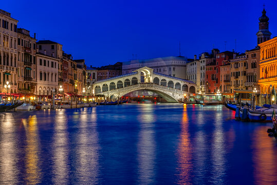 Rialto bridge and Grand Canal in Venice, Italy. Night view of Venice Grand Canal. Architecture and landmarks of Venice. Venice postcard