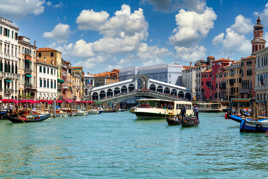 Rialto bridge and Grand Canal in Venice, Italy. View of Venice Grand Canal with gandola. Architecture and landmarks of Venice. Venice postcard