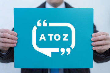 Businessman holding banner with inscription: A TO Z. A TO Z business education concept.