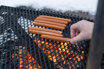 Grilling hotdogs in the winter