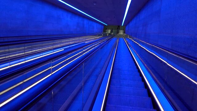 Copenhagen, Denmark The blue-lit escalator in the Gammel Strand Metro station.
