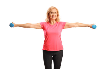 Smiling mature woman exercising with dumbbells