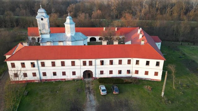 Aerial drone view of Bezdin Monastery in Arad County, Romania, Europe. Bezdin Monastery is one of the few remaining Serbian Orthodox monasteries in Romania, constructed in 1539 AD.