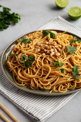 Homemade Asian Peanut Sauce Noodles on a Plate, side view.