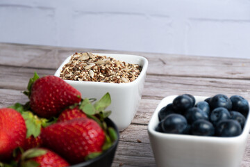 Selective targeting of containers with seeds, blueberries and strawberries.