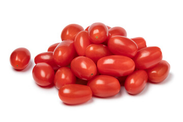 Heap of fresh small red sweet snack tomatoes isolated on white background
