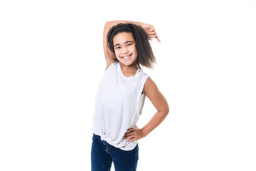 Adorable 9 years child girl on studio white background pointing with her finger