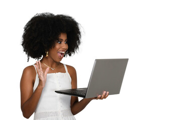 Fototapeta na wymiar young woman waves her hand looks at laptop computer screen and smiles, black woman