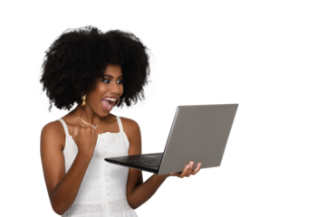 woman looks at laptop screen and gestures with her hand in positive celebration. woman young afro