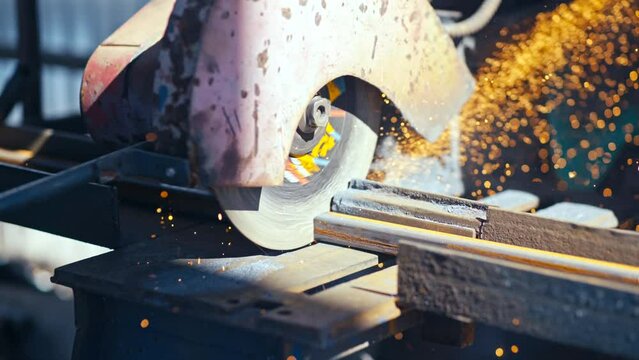 Professional welder works in a dark room with slow motion. Cinematic