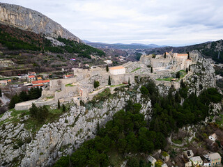 Fototapeta premium The Klis Fortress is a medieval fortress situated above a village bearing the same name, near Split, Croatia. Places of historic interest. Medieval fortress built into a rocky ridge.