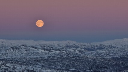 Fototapeta premium full moon over the mountains, Hovden, Norway