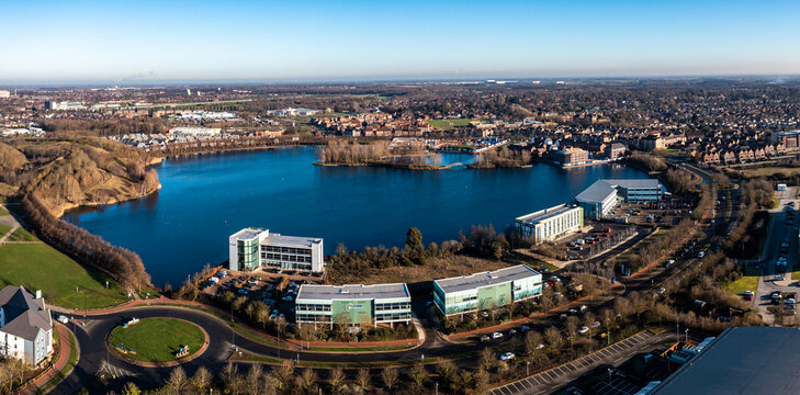 Aerial view of office blocks and real estate surrounding the lake at Lakeside in Doncaster
