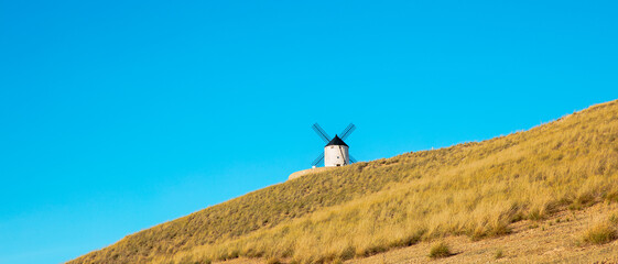 Fototapeta premium Windmill in countryside and blue sky