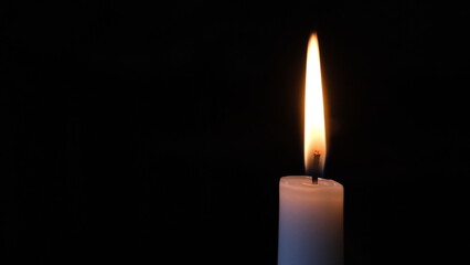 Candle light motionless black background