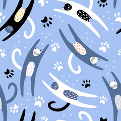Cute colorful hand drawn cats with paws shape on blue background. Seamless vector cute pattern with pet animal. Print for nursery