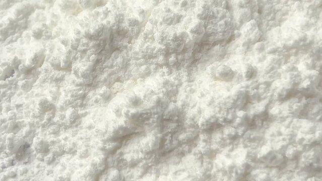 White powder texture video. Rotating. Close up.