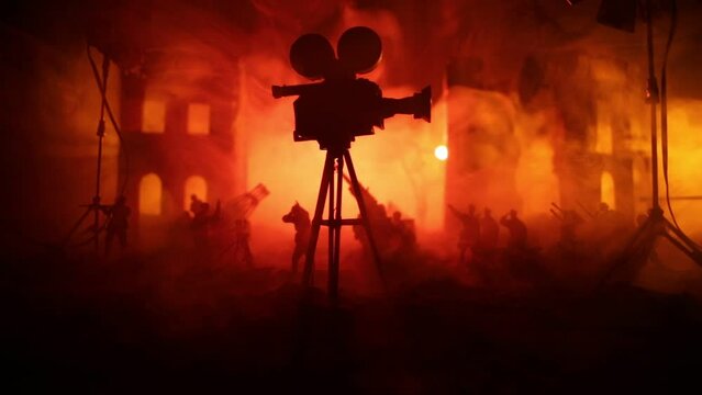 Action (War) movie concept. Man moving out with little boy from burned out city destroyed in war. Military fighting silhouettes. Selective focus