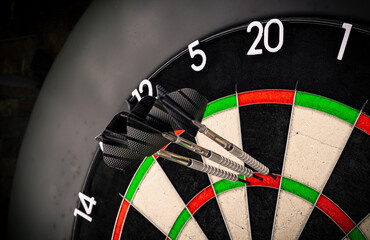 Three darts triple twenty on professional sisal steeldart. perfect 180 highscore shot dart game hobby sport concept background. - 563104532