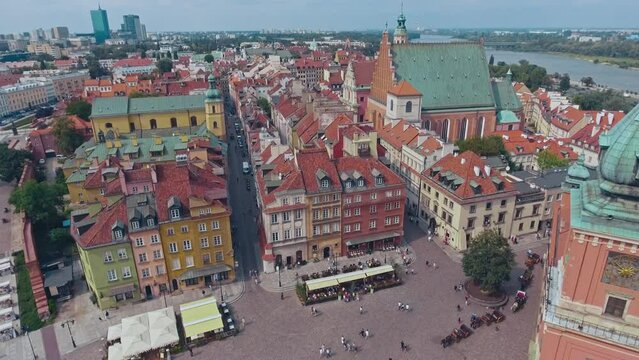 aerial view of Warsaw old town, historical centre of Warsaw at sunrise, flying above Warsaw royal castle, capital of Poland, tourism in Eastern Europe. High quality 4k footage