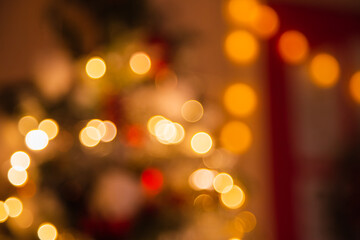 blurred background of lanterns on christmas tree. Christmas bokeh