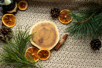Obraz na płótnie Canvas Green tea in a transparent, glass teapot, dried oranges and Christmas atmosphere, Christmas tree branches