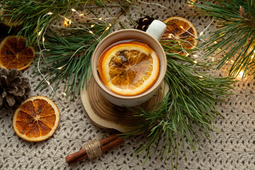 Obraz na płótnie Canvas Green tea, Christmas tree branches, dried oranges, cloth mat