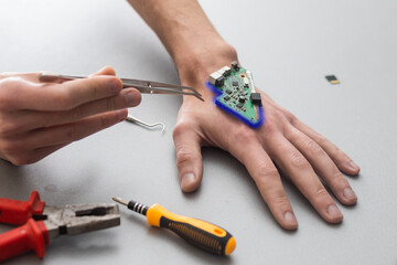 Bionic microchip inside human body - future technology and cybernetics concept.