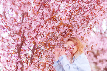 Spring banner with girl outdoor. Cherry Blossom Events and Locations. Womens day, 8 march. Happy...