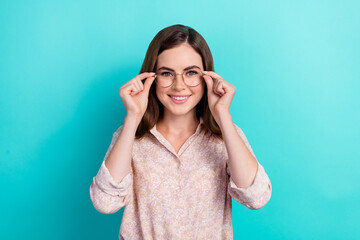 Photo of adorable sweet lady wear pink shirt smiling arms hands spectacles isolated turquoise color background