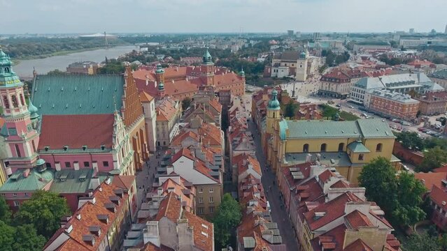 aerial view of Warsaw old town, historical centre of Warsaw at sunrise, flying above Warsaw royal castle, capital of Poland, tourism in Eastern Europe. High quality 4k footage