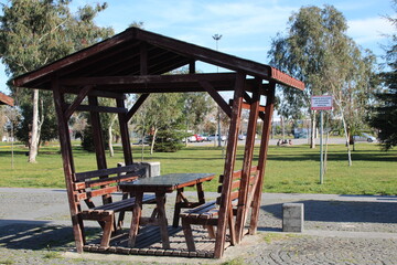Picnic benches for families at a big park