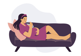 Young pregnant woman relaxing on sofa, drinking water. 