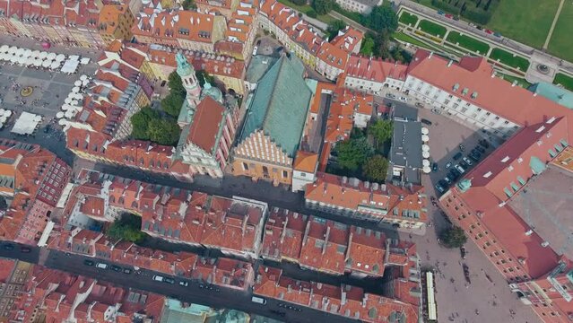 aerial view of Warsaw old town, historical centre of Warsaw at sunrise, flying above Warsaw royal castle, capital of Poland, tourism in Eastern Europe. High quality 4k footage