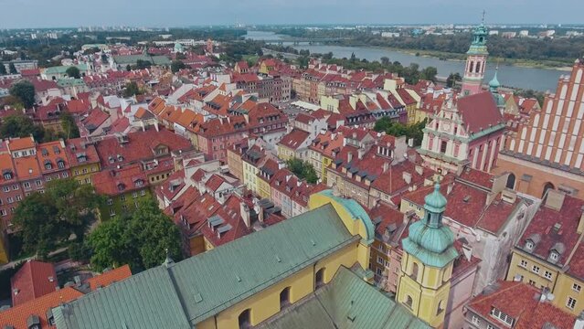 aerial view of Warsaw old town, historical centre of Warsaw at sunrise, flying above Warsaw royal castle, capital of Poland, tourism in Eastern Europe. High quality 4k footage