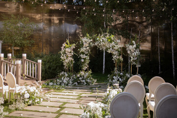 Wedding ceremony. Very beautiful and stylish wedding arch, decorated with various fresh flowers,...