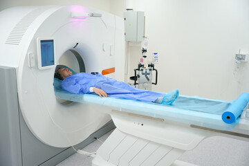 Patient undergoes an MRI diagnostic procedure using modern equipment