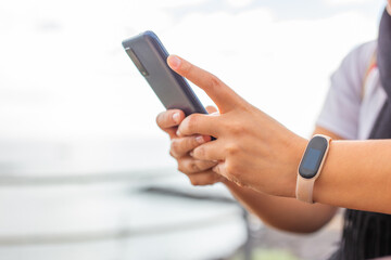 Woman hand selecting content on a smart phone