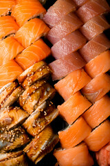 Close-up top view of sushi set of various philadelphia rolls with salmon, tuna, eel