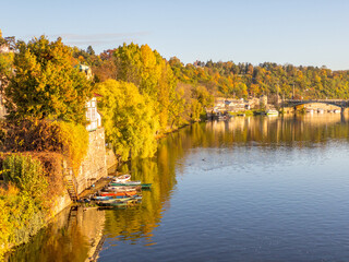 Colors of autumn Prague. Picturesque autumn colors on the embankment by the Vltava river, Prague, Czech Republic