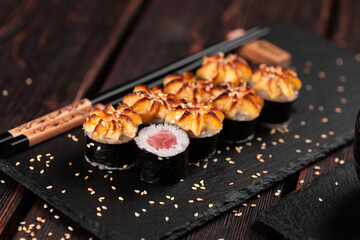 Japanese hot maki roll sushi with tuna - asian food concept