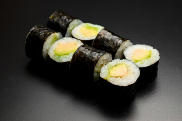 classic vegetarian sushi rolls with tofu and rice wrapped in nori.