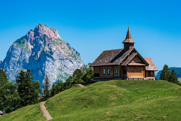 Fototapeta na wymiar Switzerland 2022, Beautiful view of the Alps from Fronalpstock. Church.