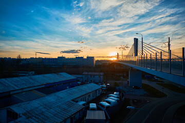 Sunset in the city, urbanized, public transport, warehouse